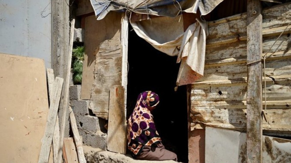 Photo of woman sitting in her house